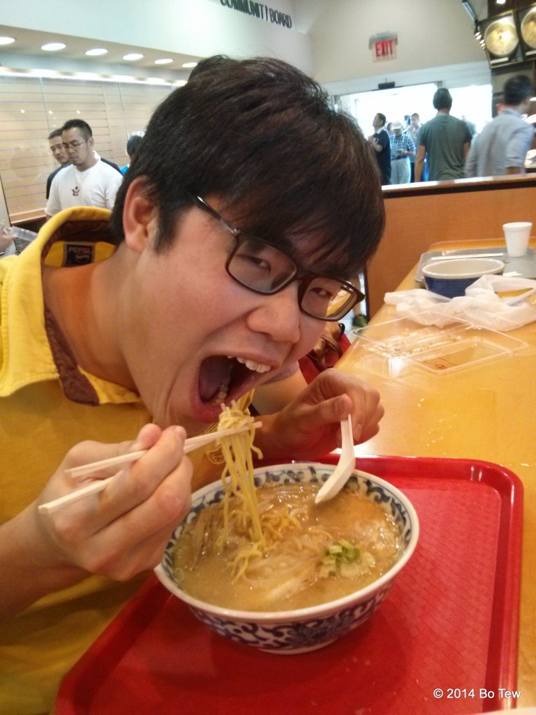 Me getting a huge bite of ramen.