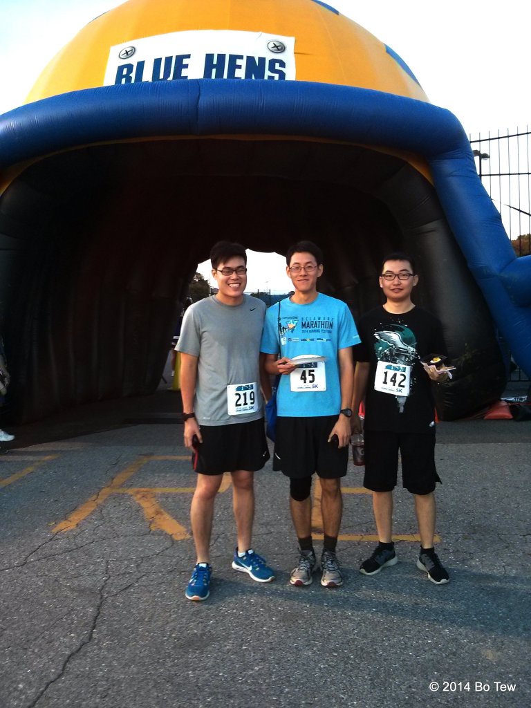 Me, Eric and XiangYu after the race behind the huge BLUE HEN helmet.